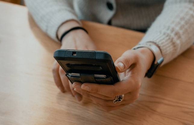 person using phone to contact