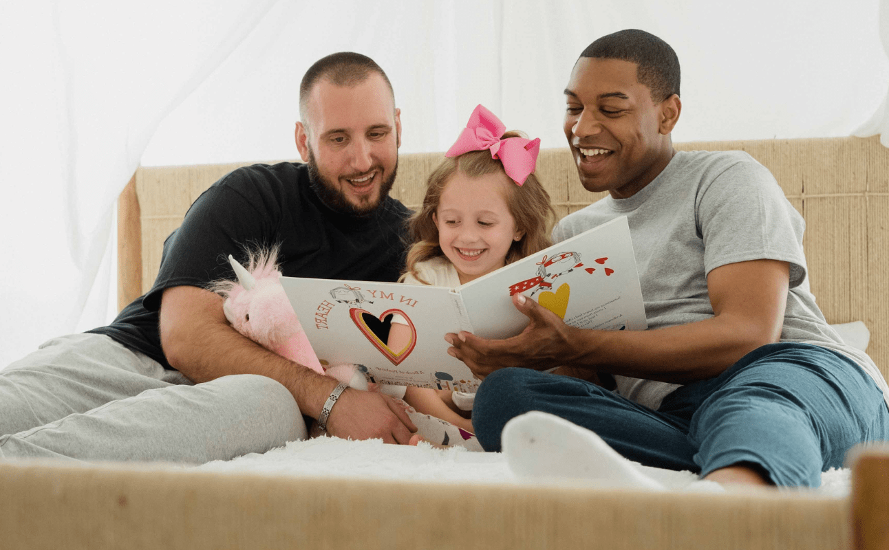 Adoptive dads with their daughter