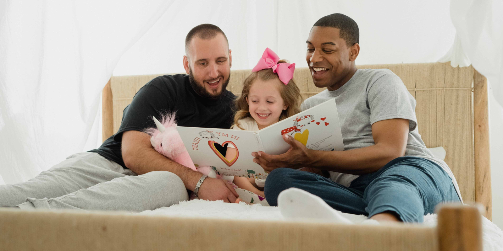 Adoptive LGTBQ couple with their daughter
